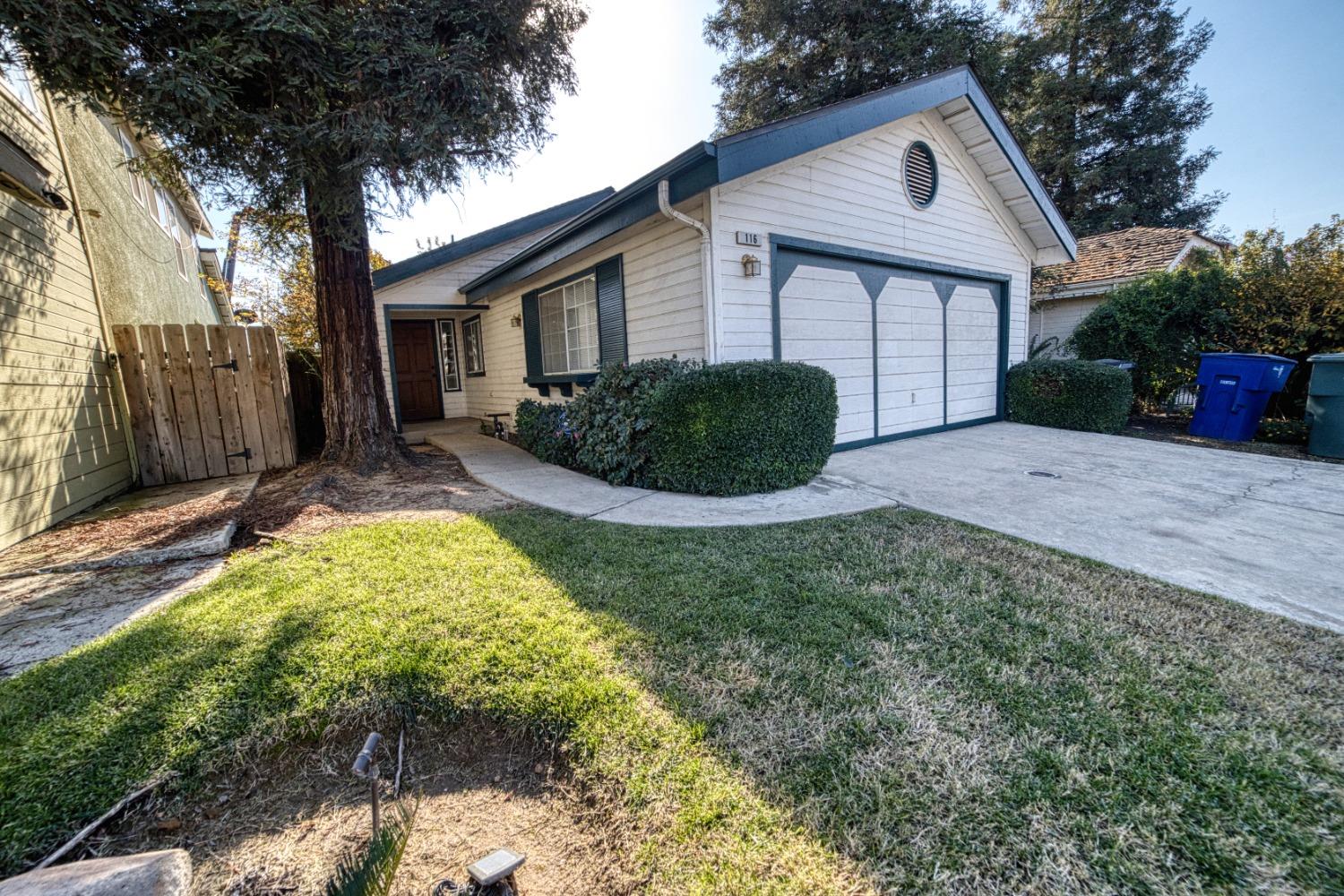 a view of an house with backyard space and garden