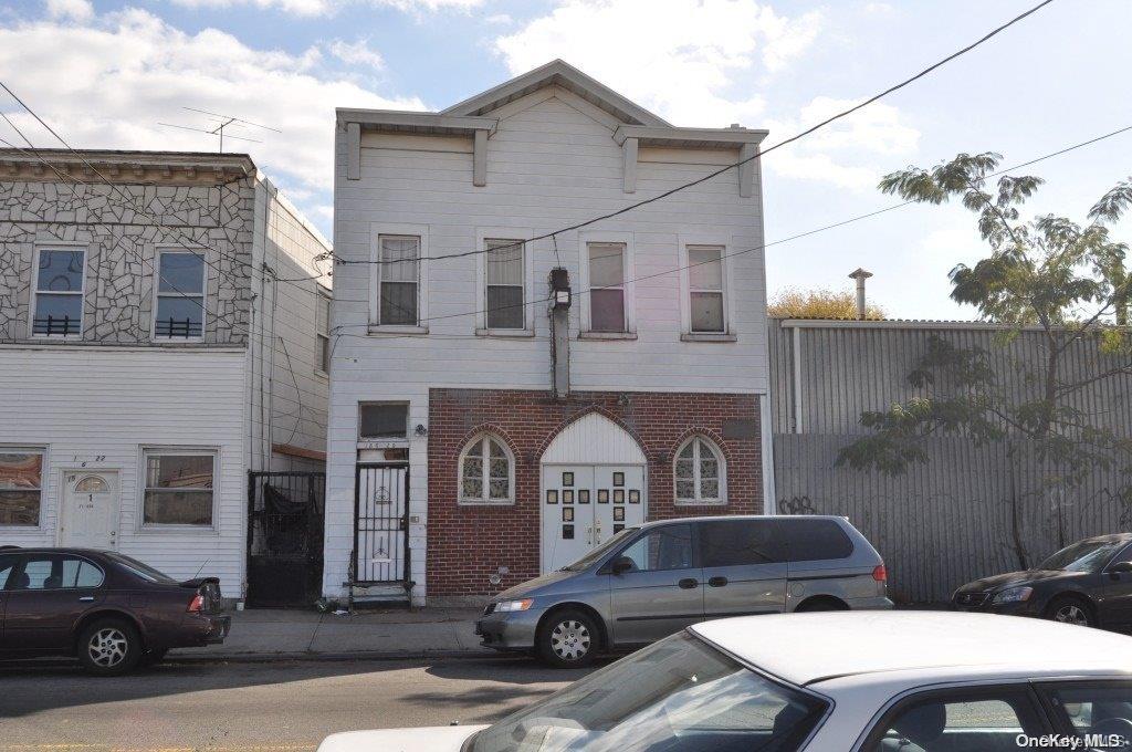 a car parked in front of a brick building