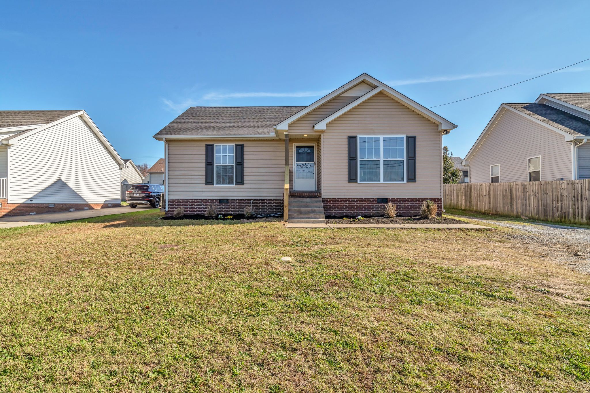 a front view of a house with a yard