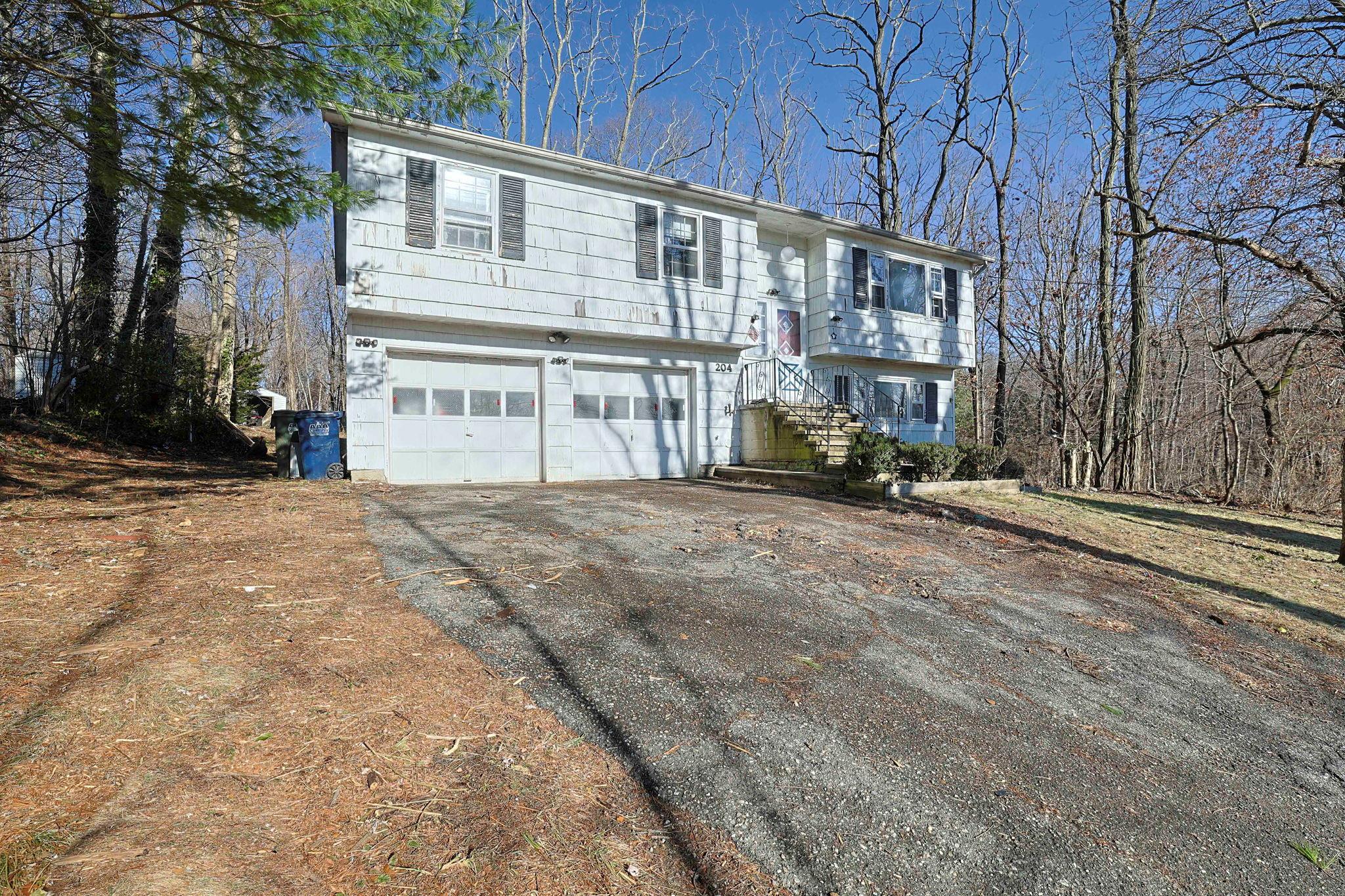 Raised ranch featuring a garage