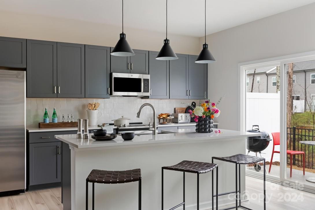 a kitchen with a sink cabinets and window