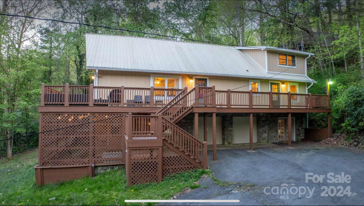 a view of a house with a sink and outdoor seating