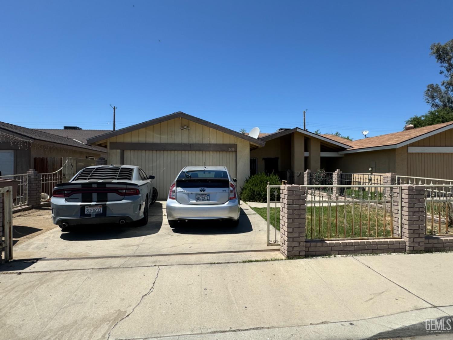 a car parked in front of a house