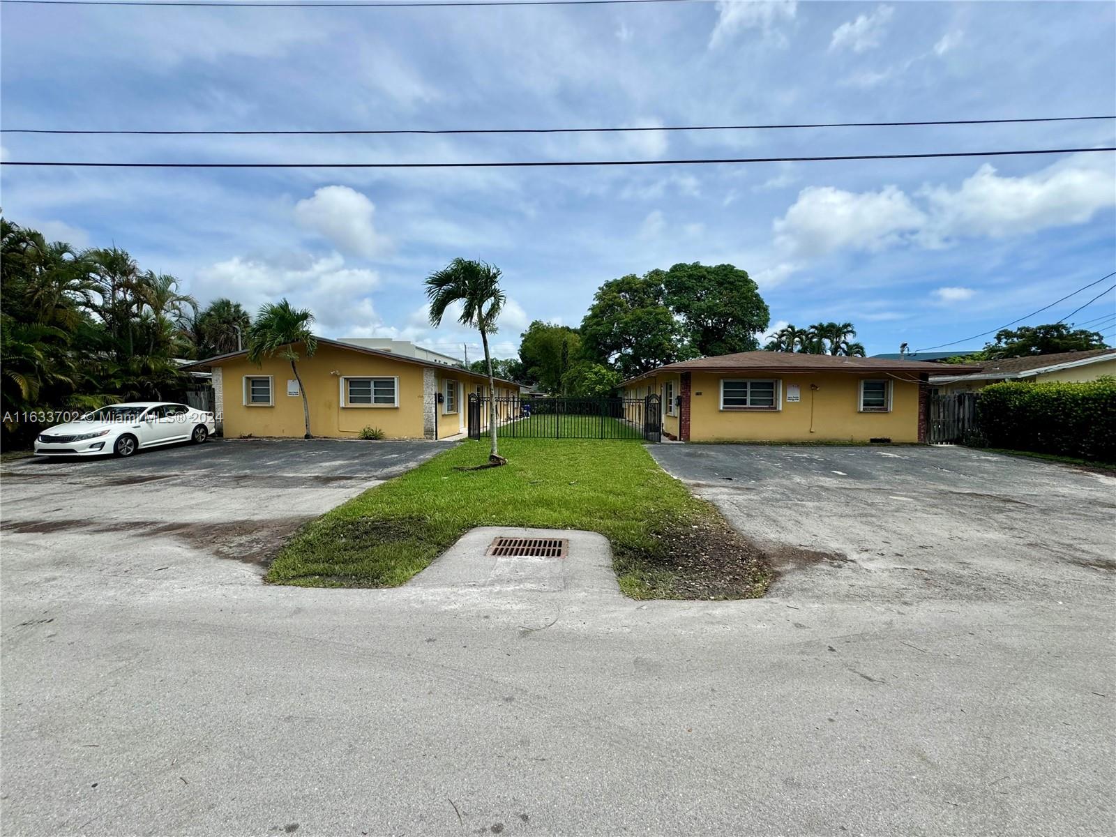 a view of a car park in front of a house