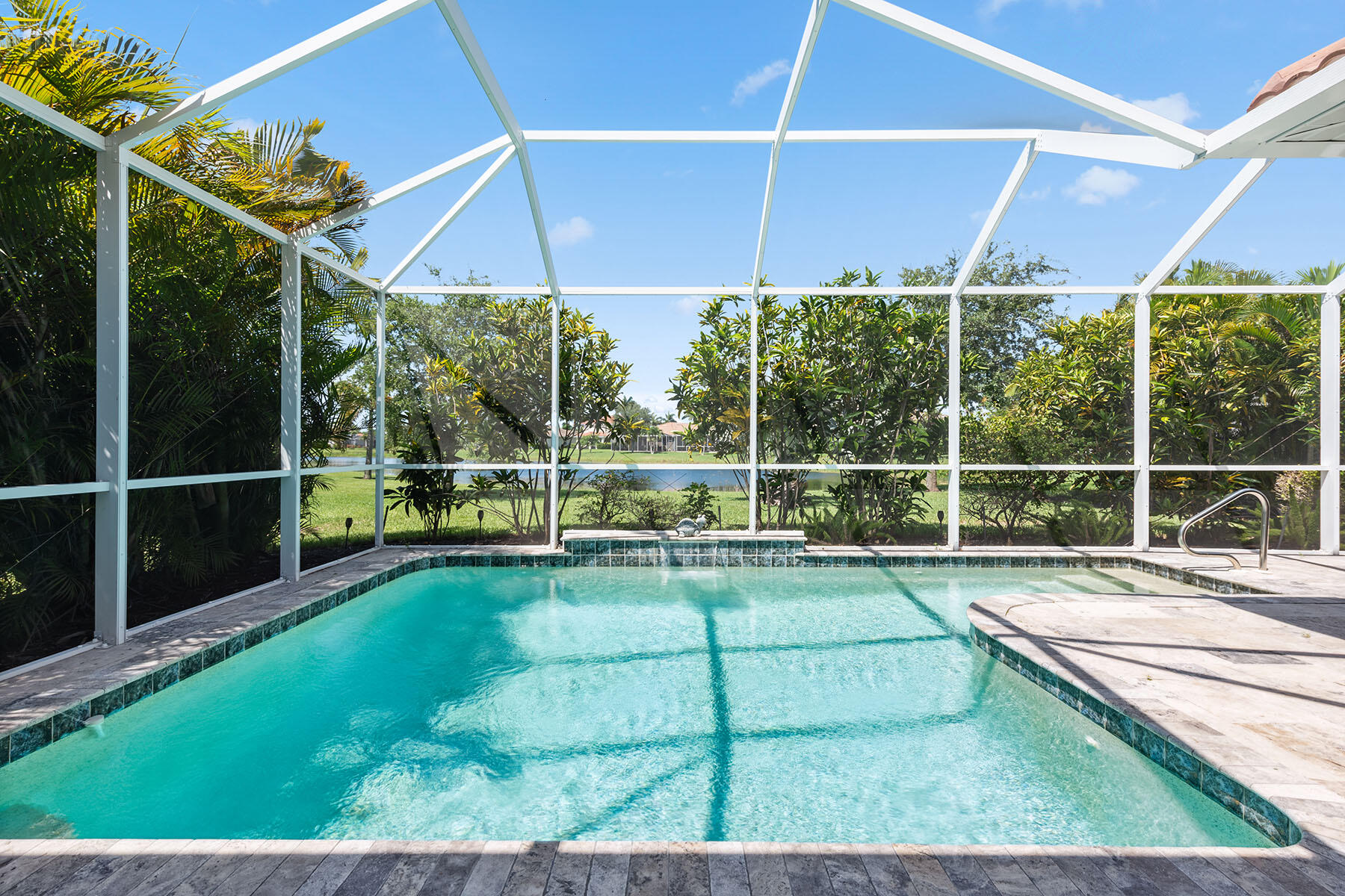 a view of a backyard with table and chairs under an umbrella