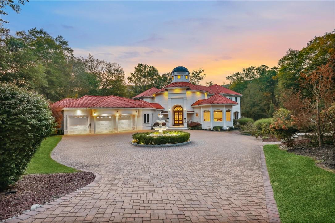 Mediterranean / spanish house with a garage