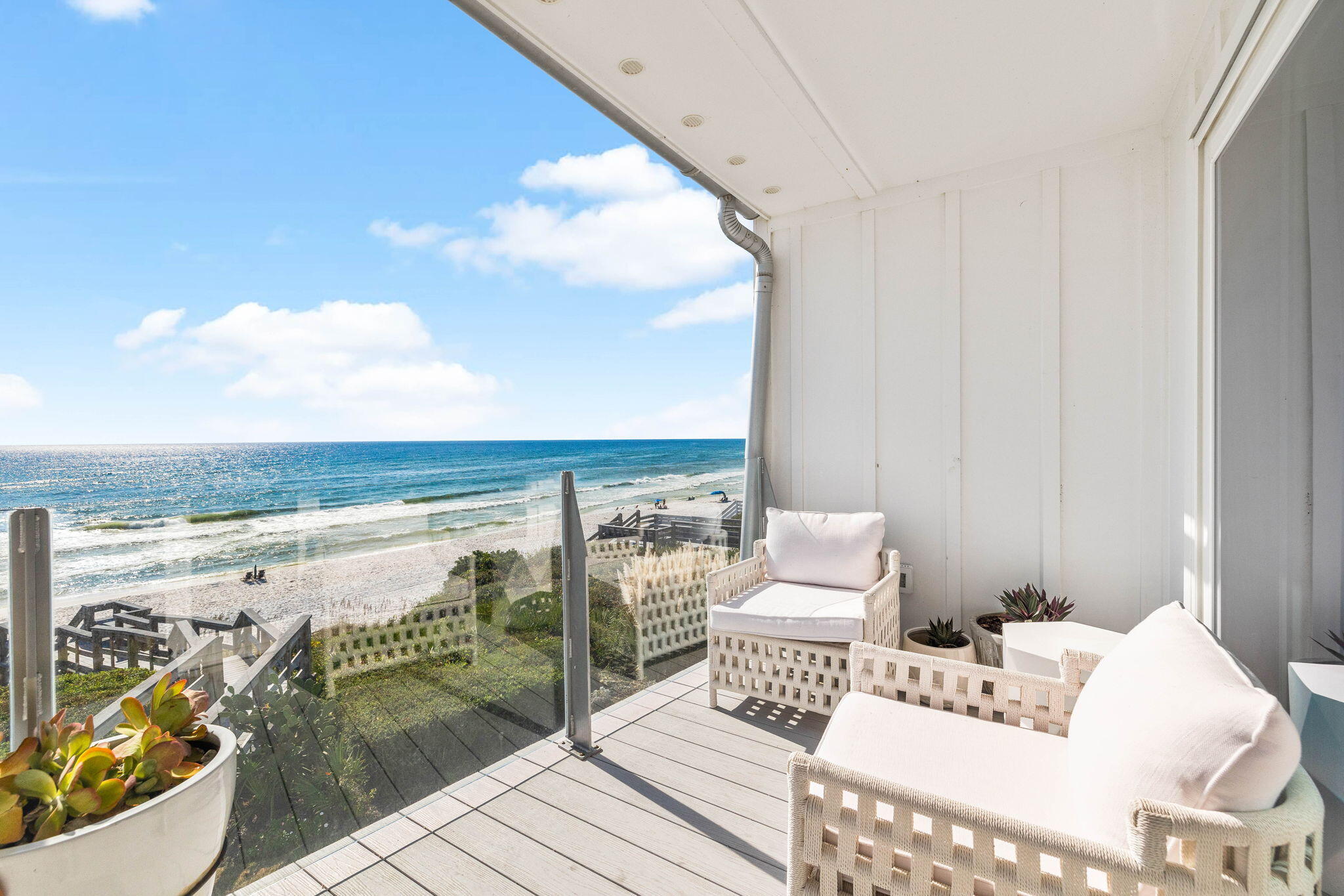 a view of a balcony with chair and table