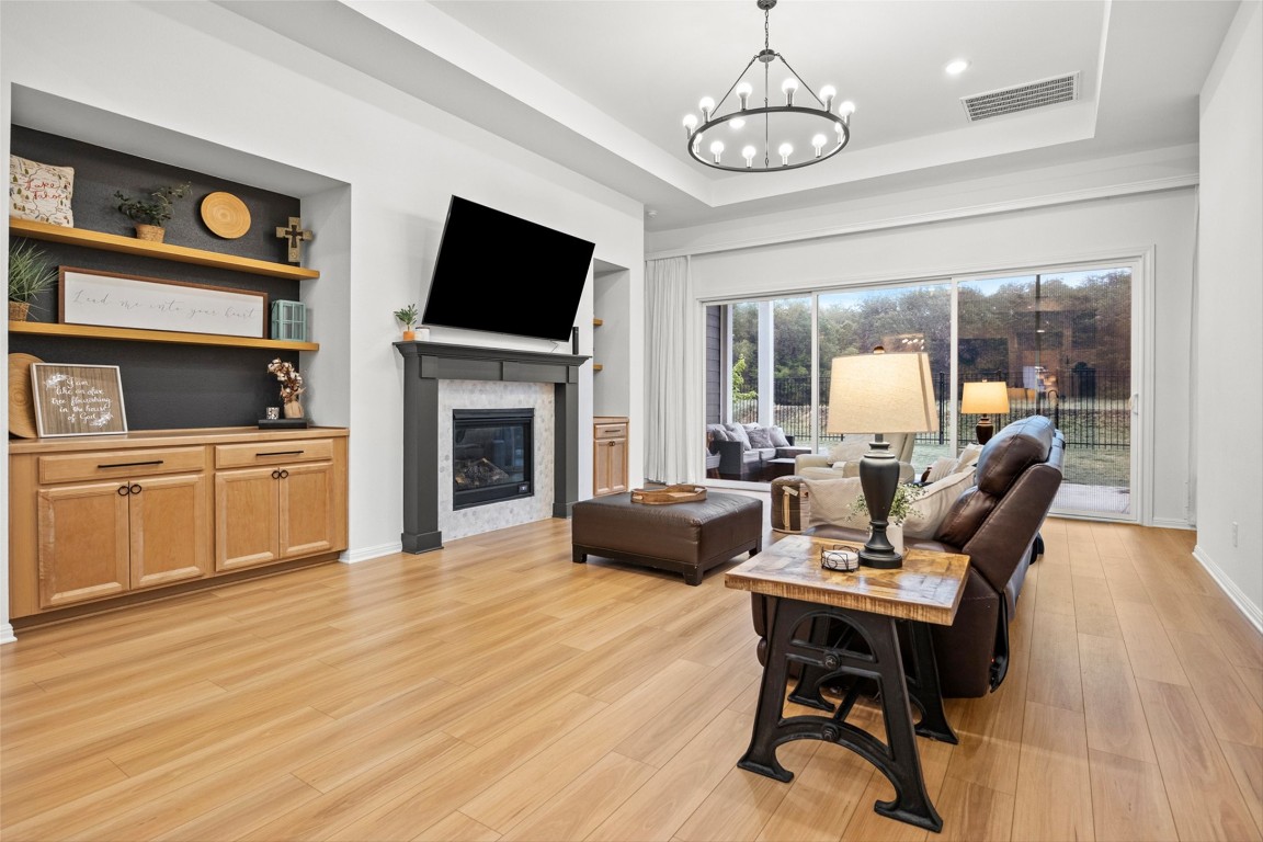 a living room with furniture fireplace and flat screen tv