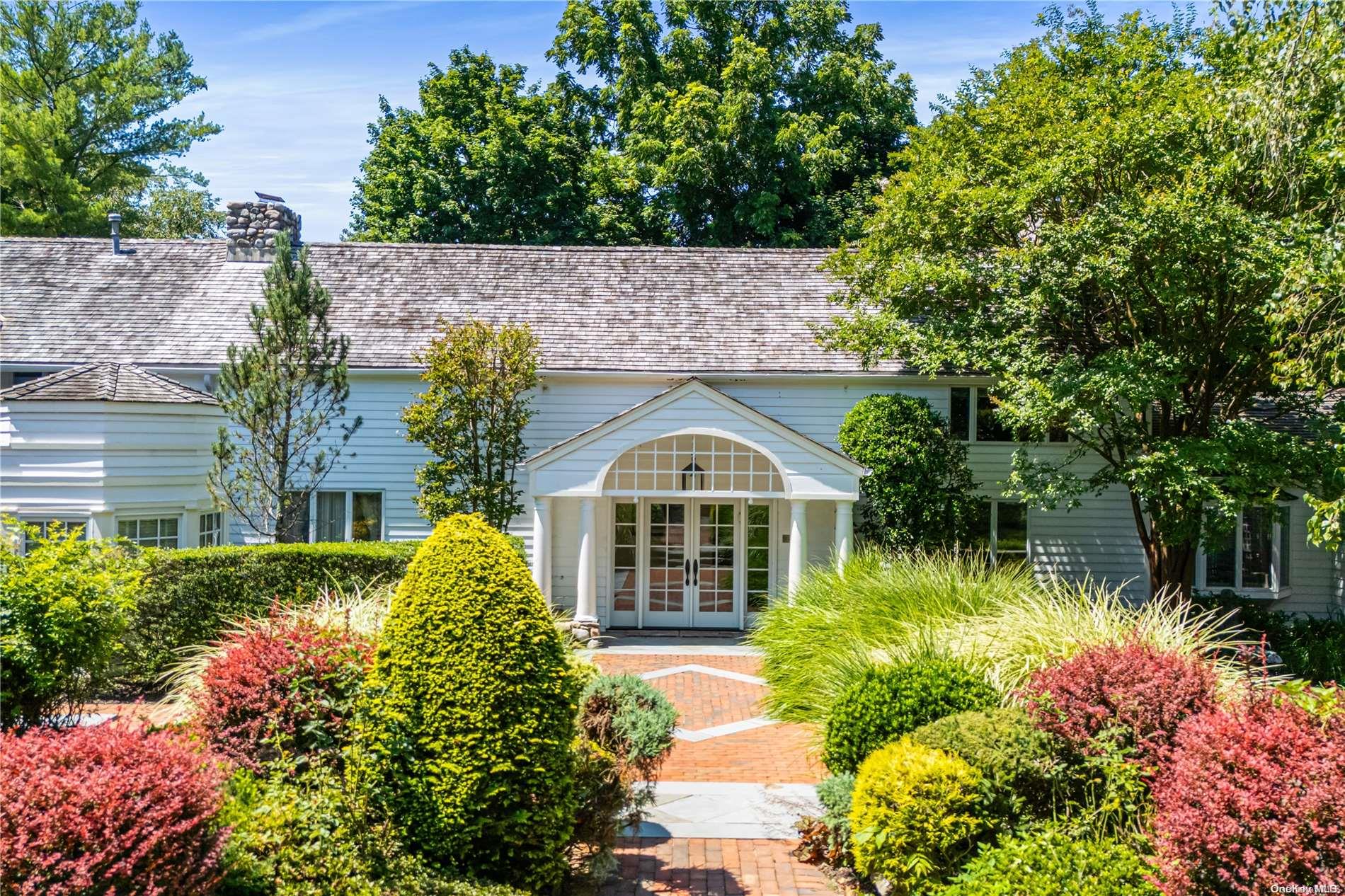 front view of a house with a small yard