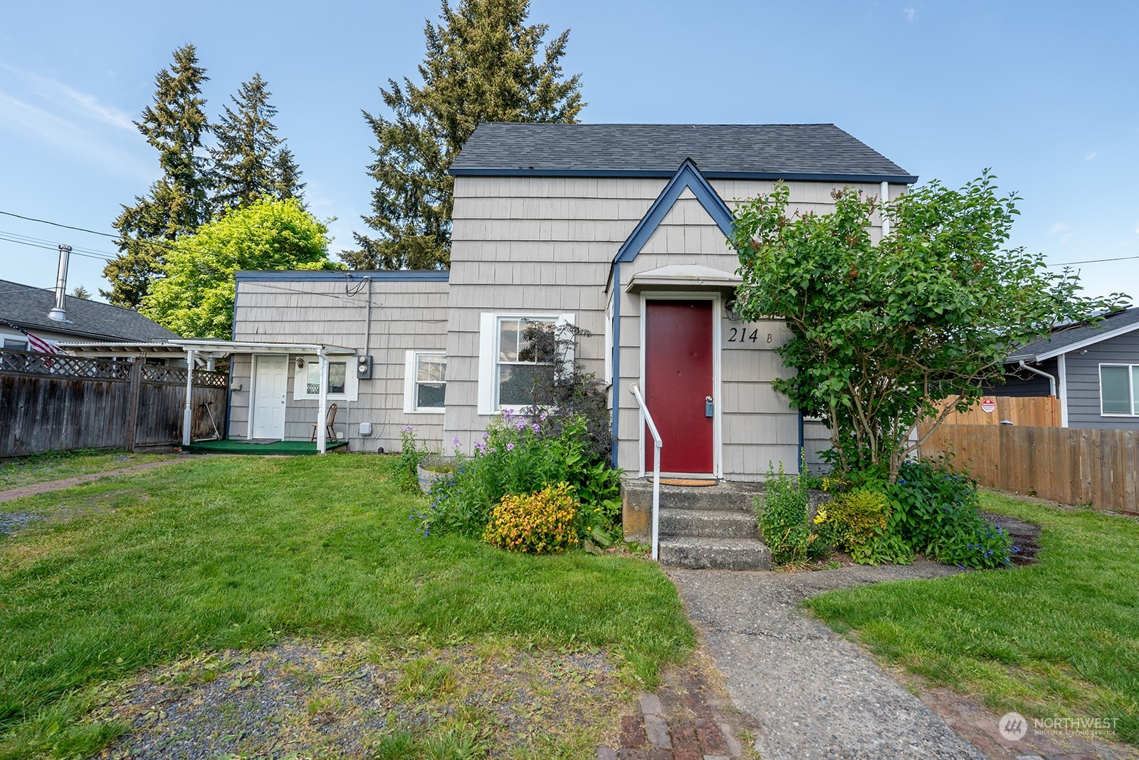 front view of a house with a yard