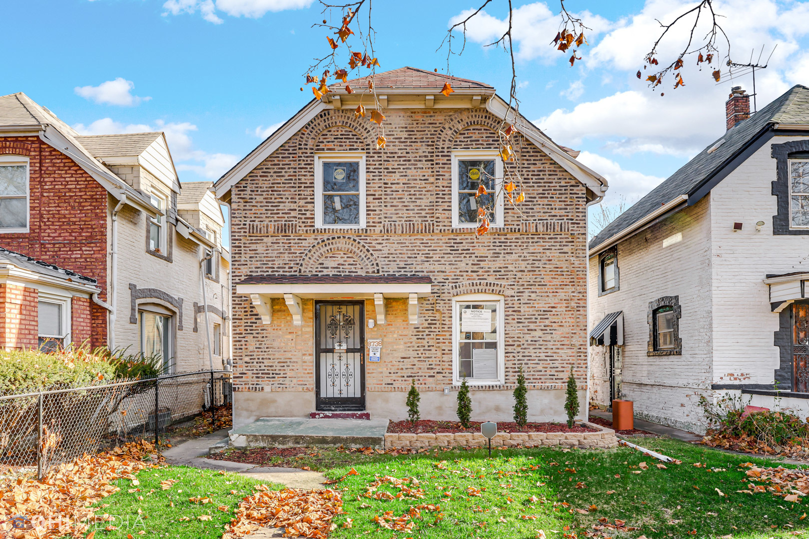 a front view of a house with a yard