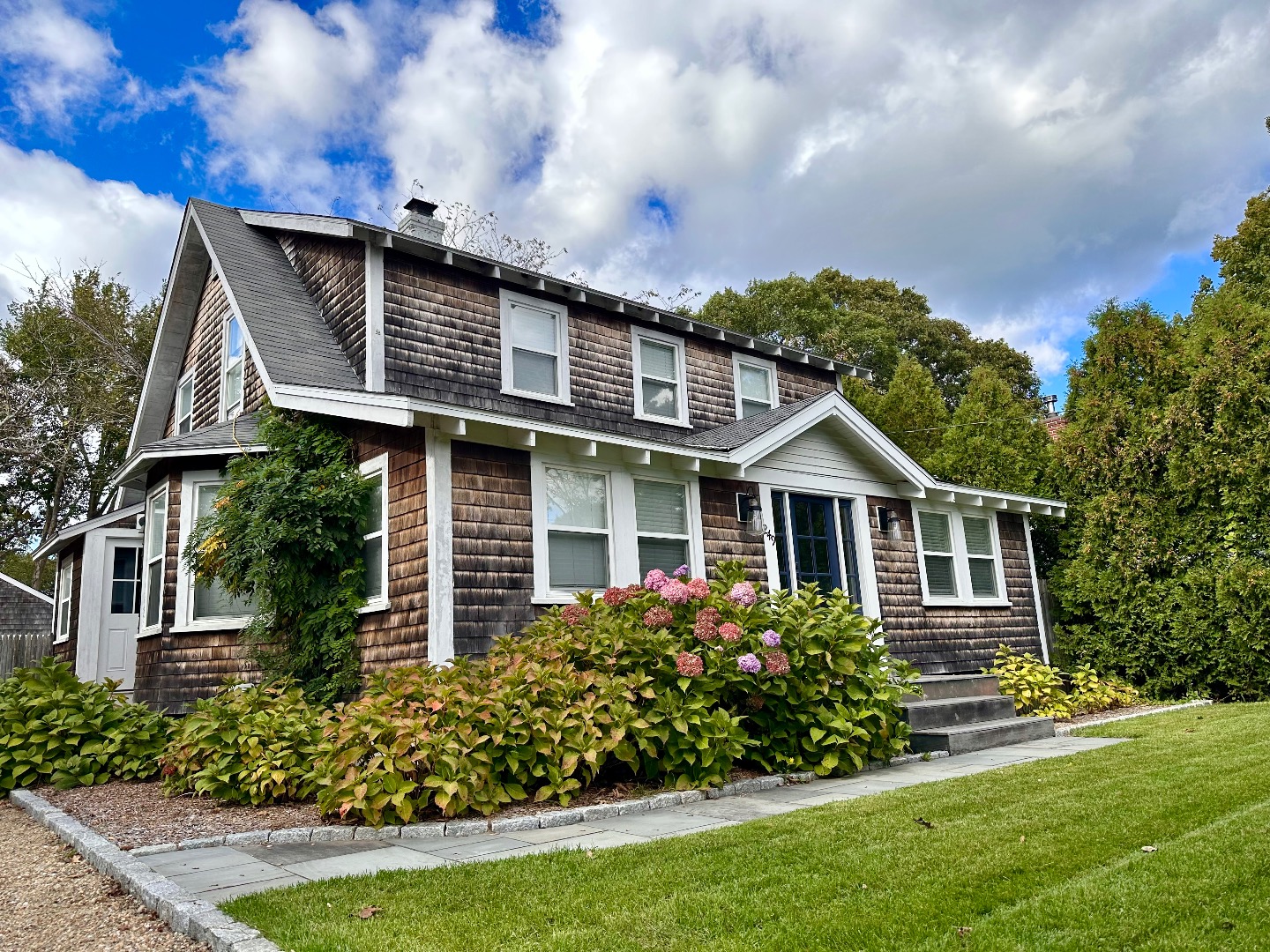 a front view of a house with garden