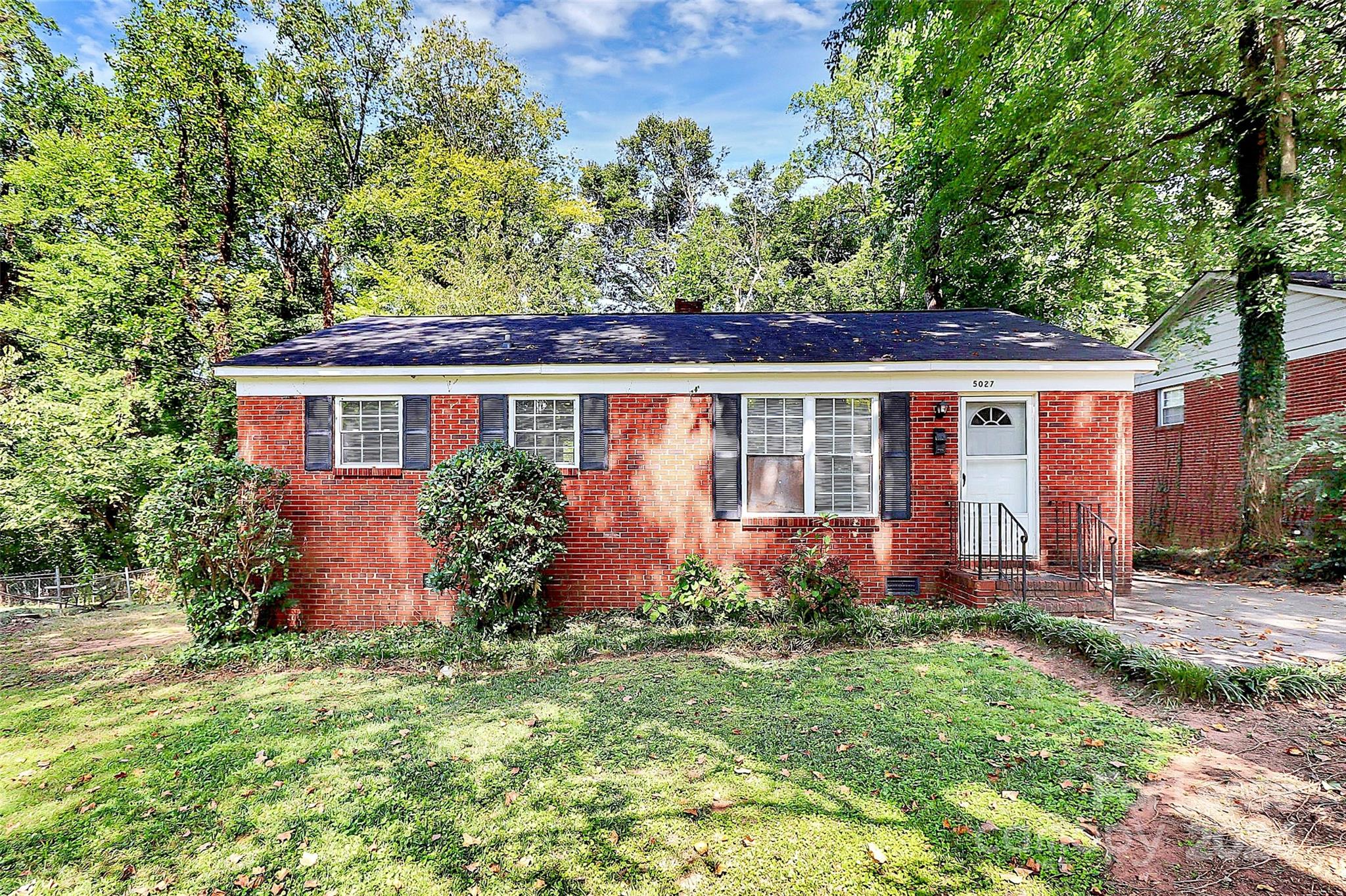 front view of a house with a yard