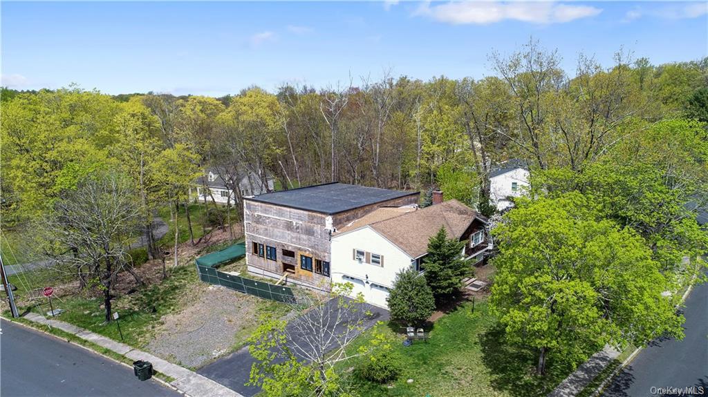 an aerial view of a house with mountain view