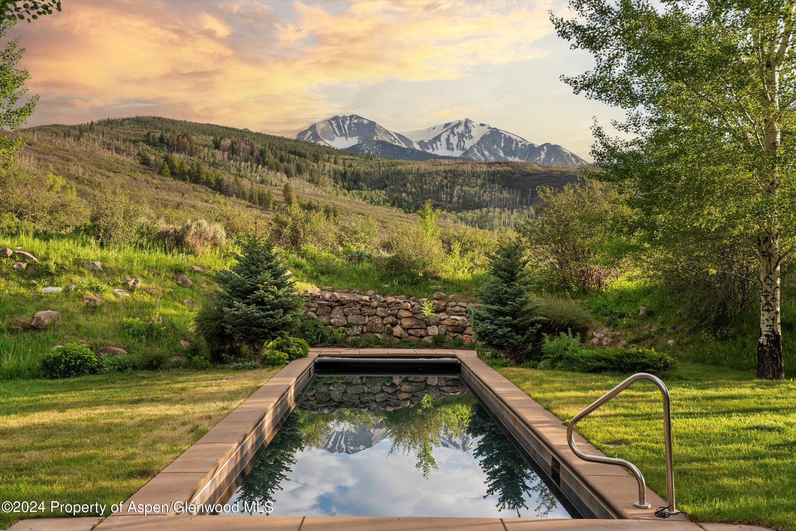 a view of a pool with a yard