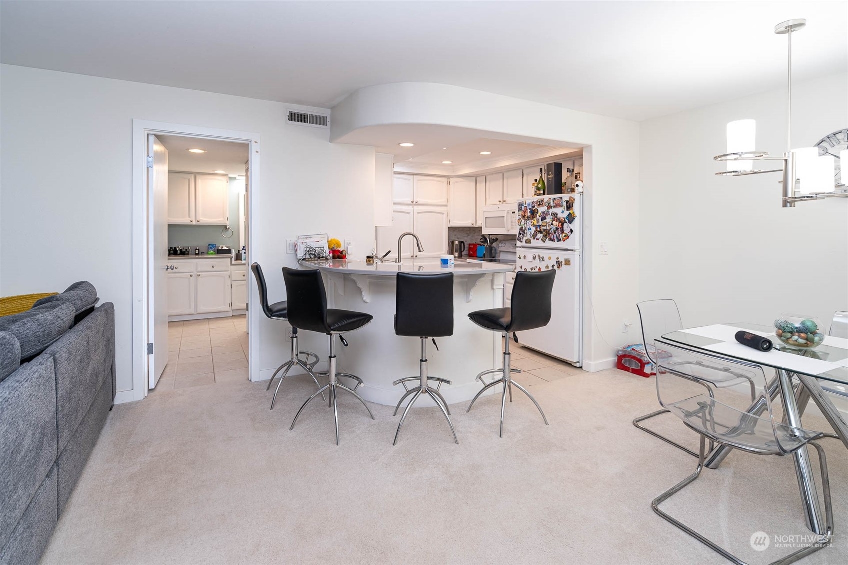 a dining room with a table and chairs