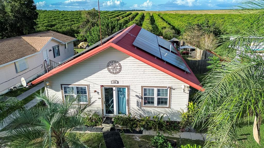 a aerial view of a house with a yard