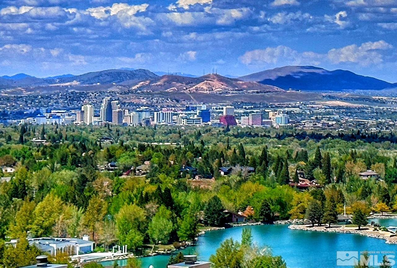 a view of a city with a lake