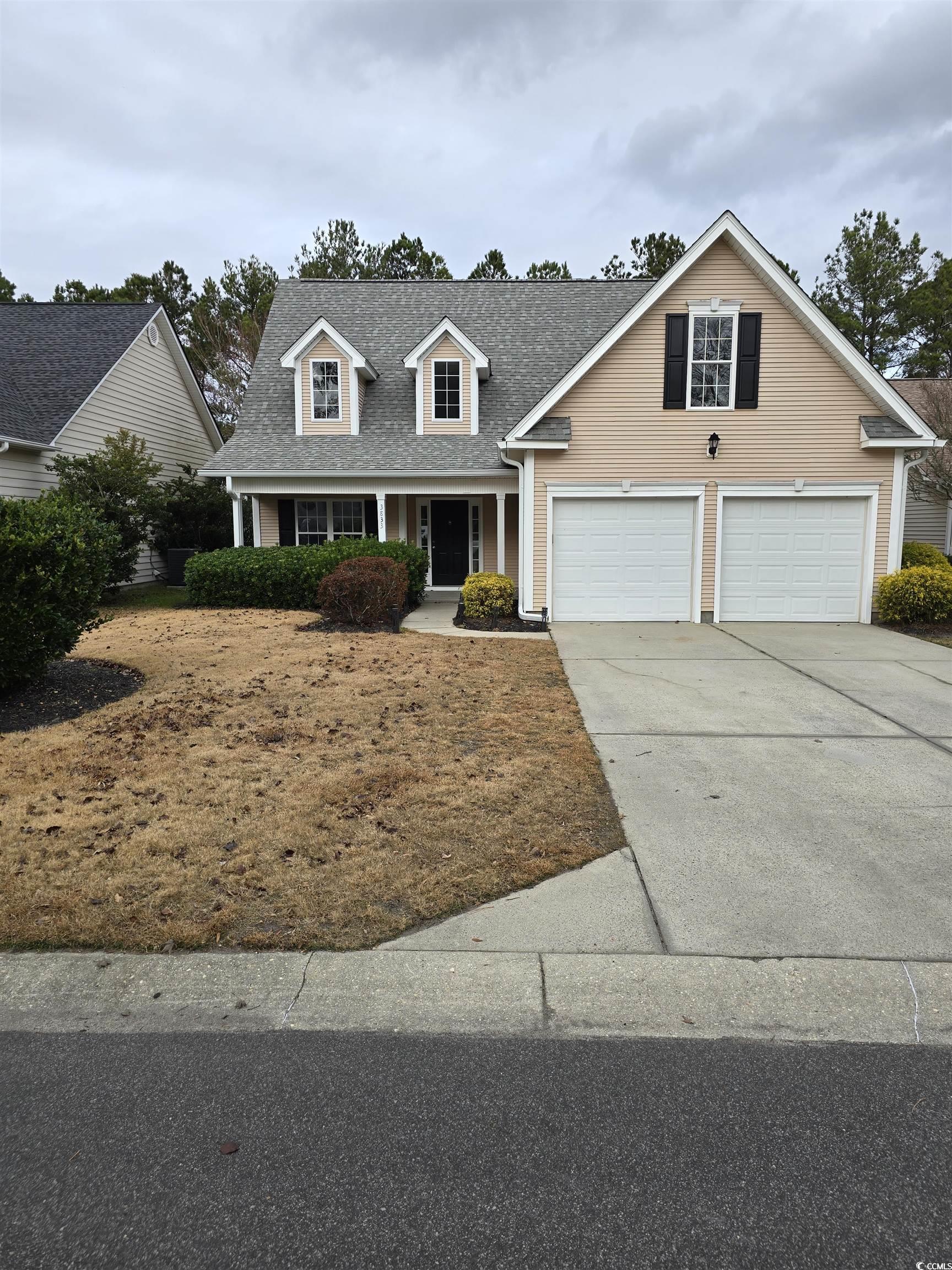 View of front of property featuring a garage