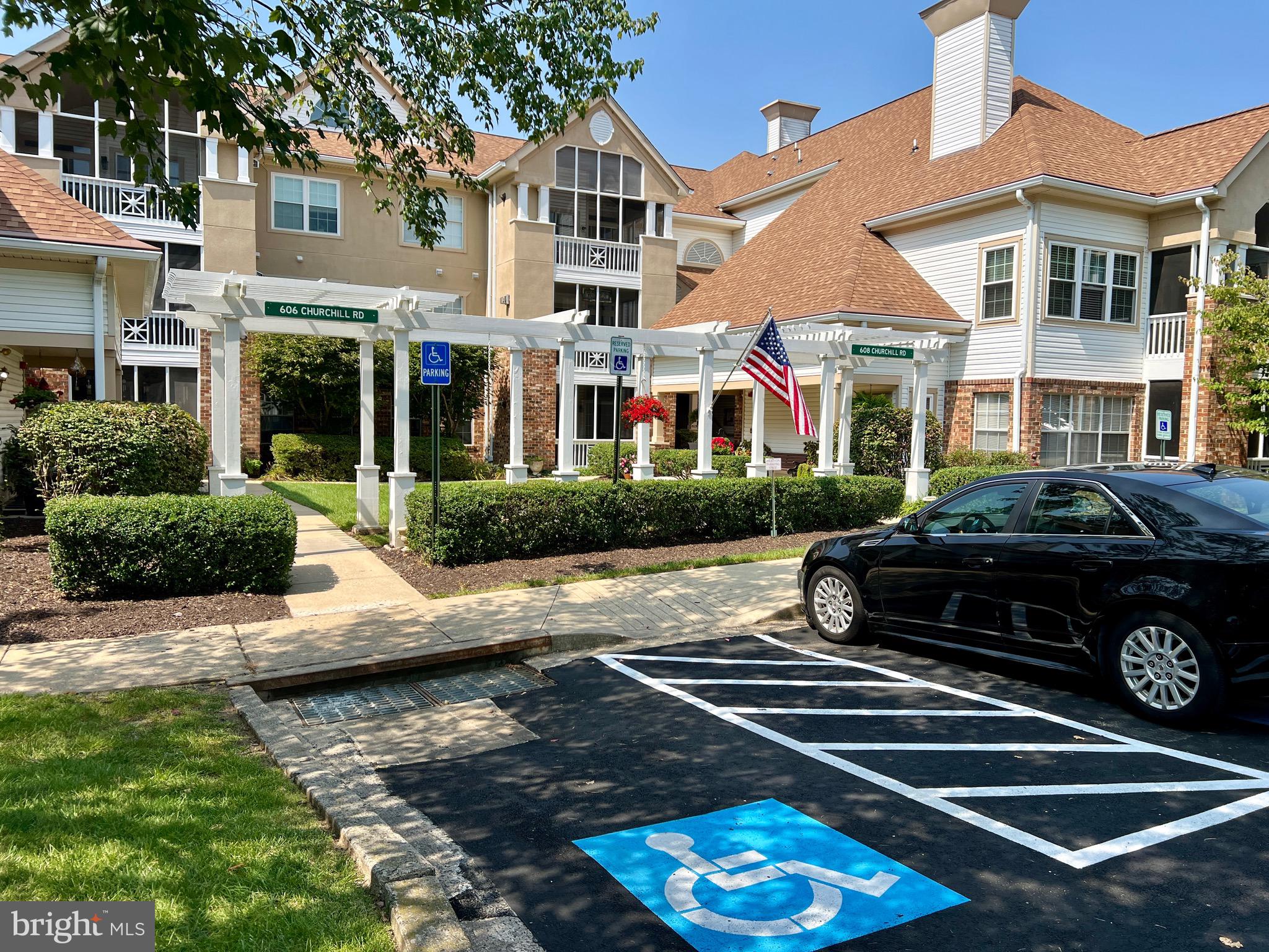 a car parked in front of a brick house