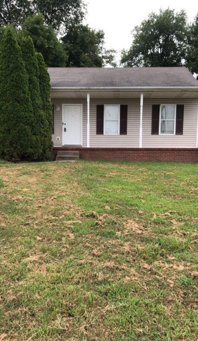 a front view of a house with yard