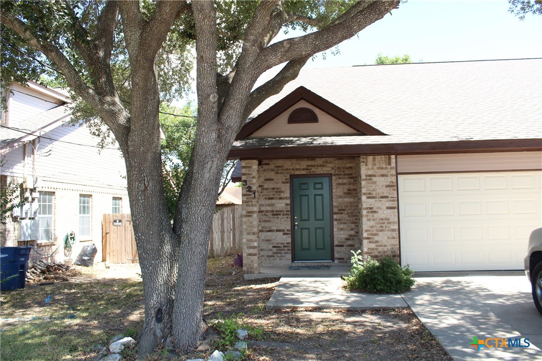 a front view of a house with yard