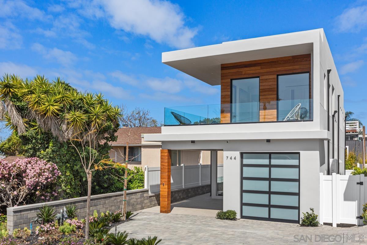 a front view of a house with a garage