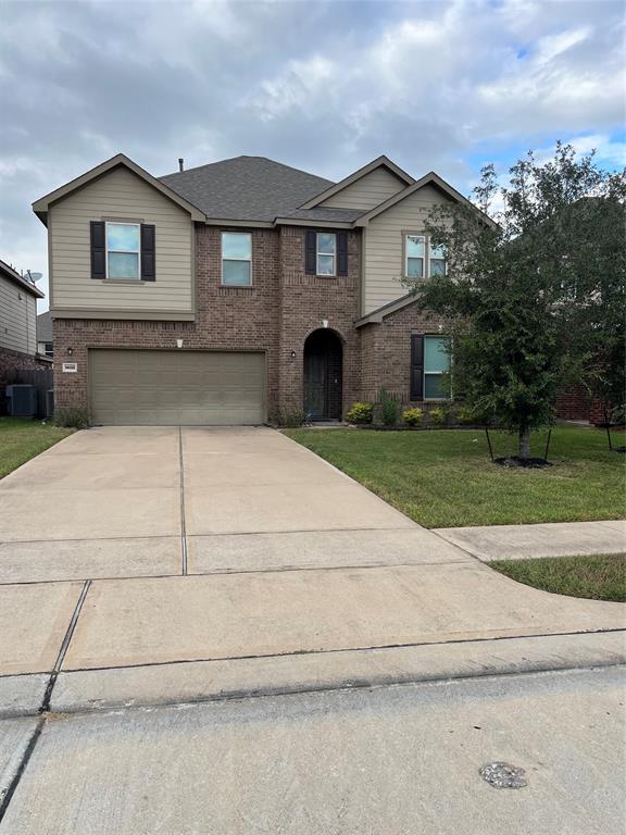 a front view of a house with yard