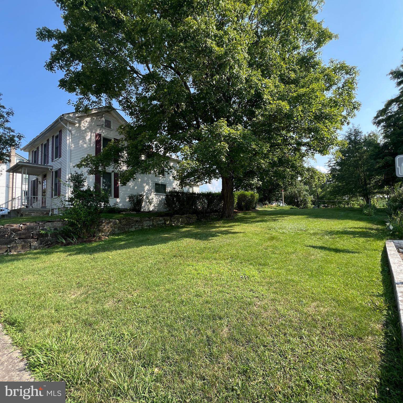 a view of a house with a big yard