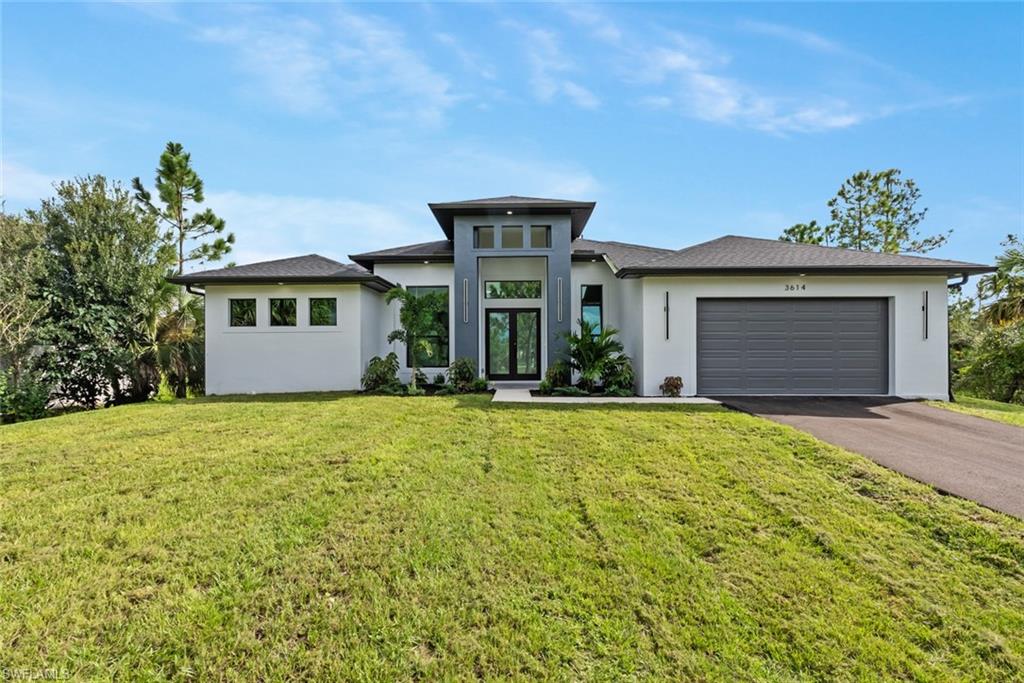 a front view of a house with a yard