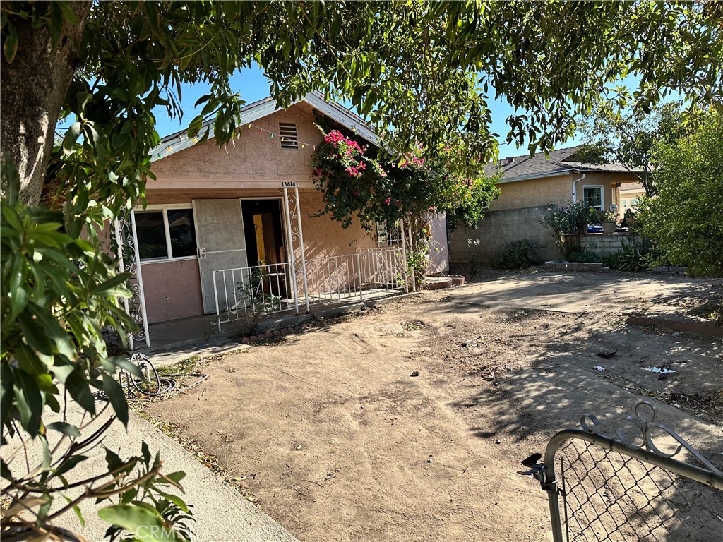 a view of house with yard