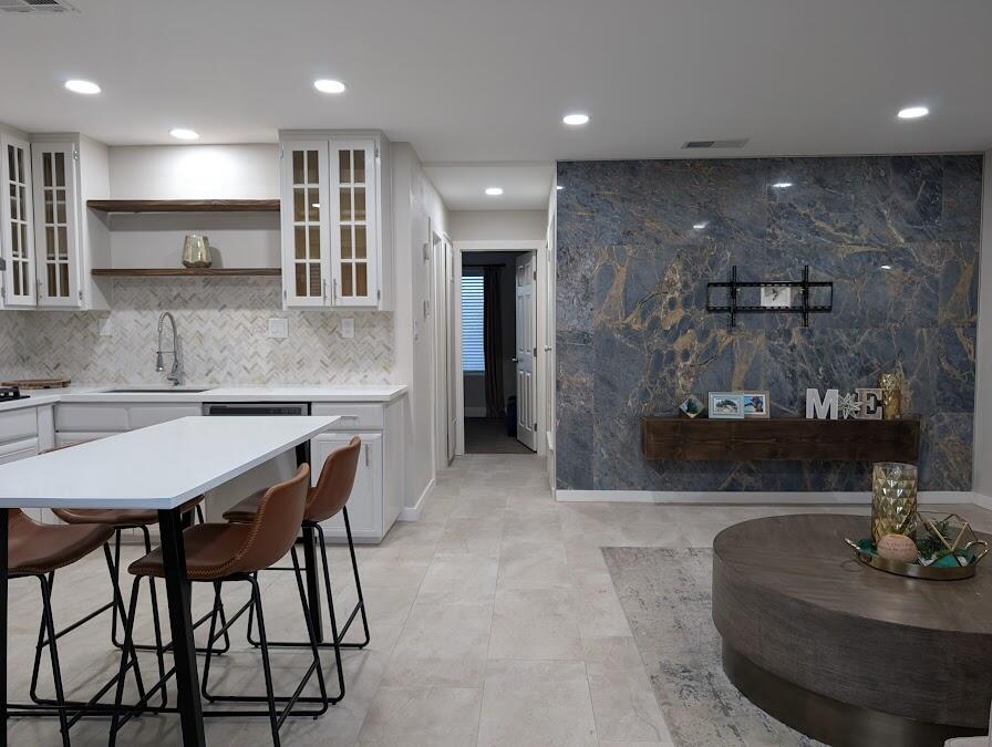 a kitchen with a table and chairs in it