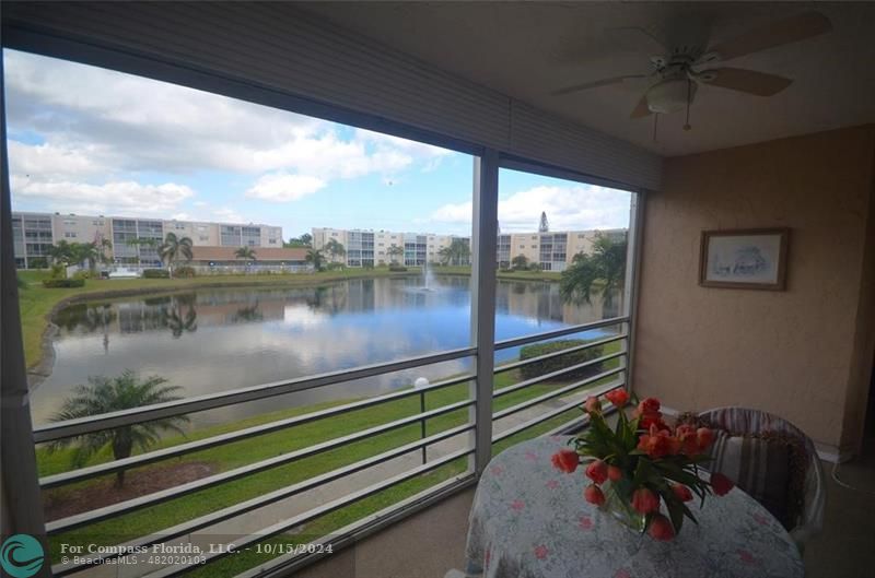 a lake view with a sitting space and garden