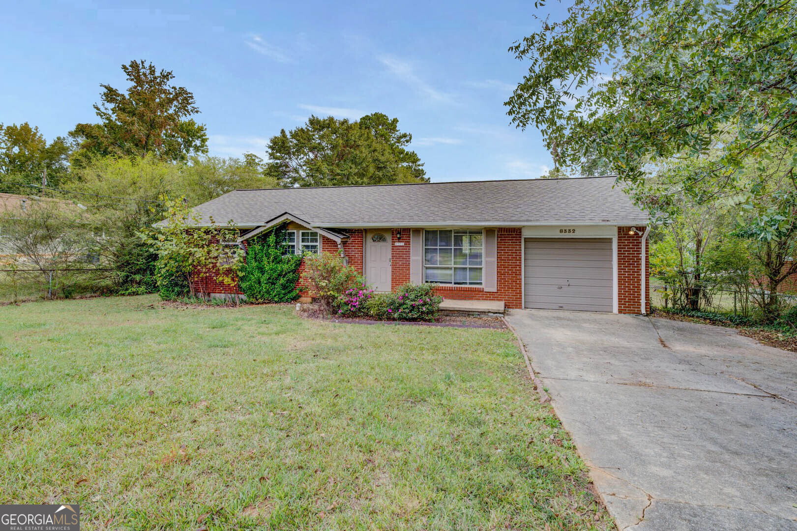 front view of a house with a yard