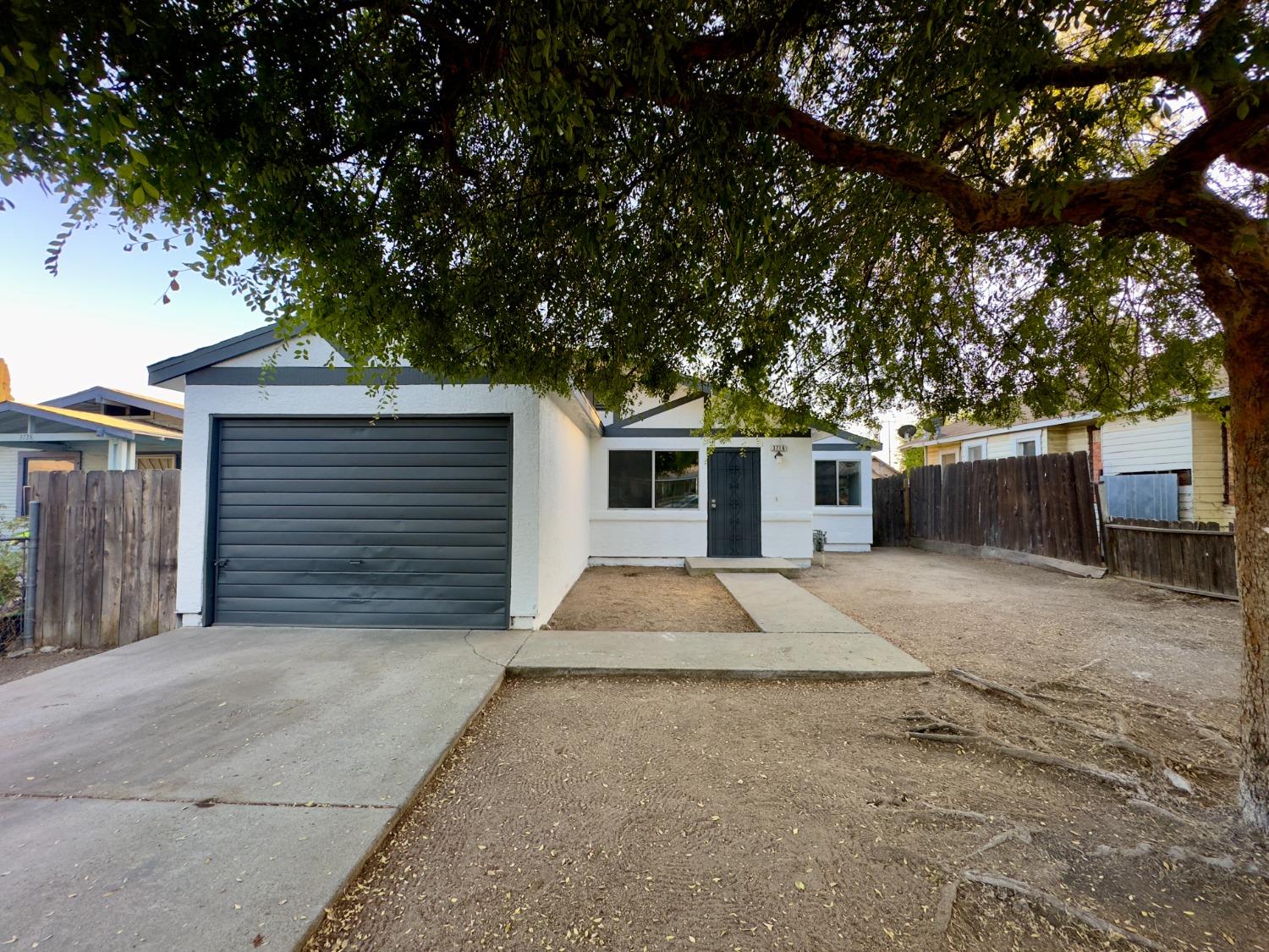 a front view of a house with a garage