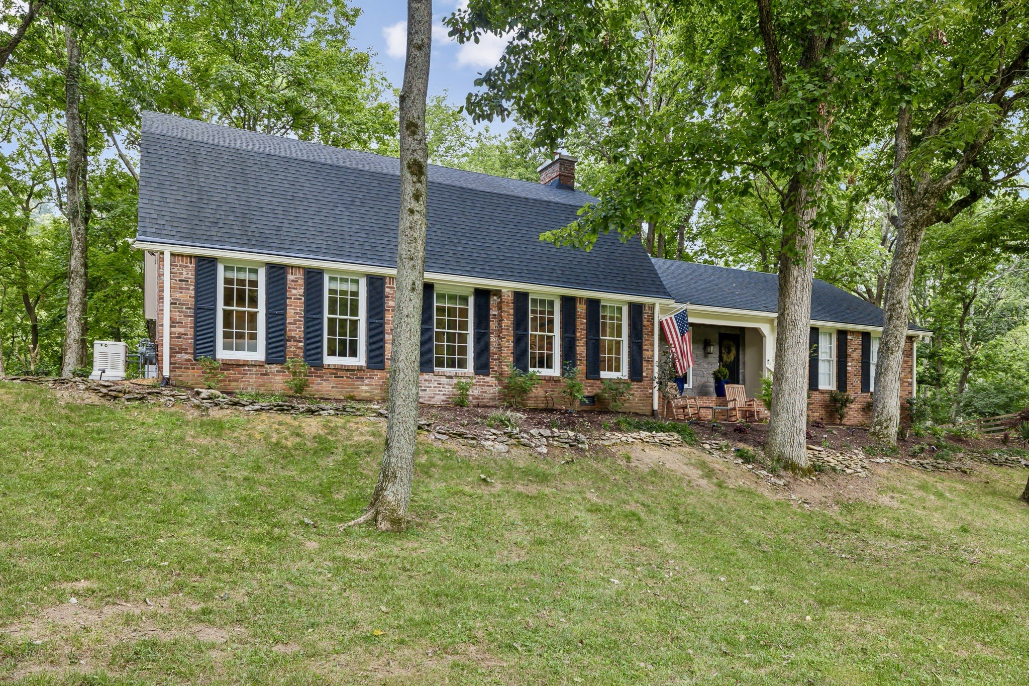 front view of a house with a yard