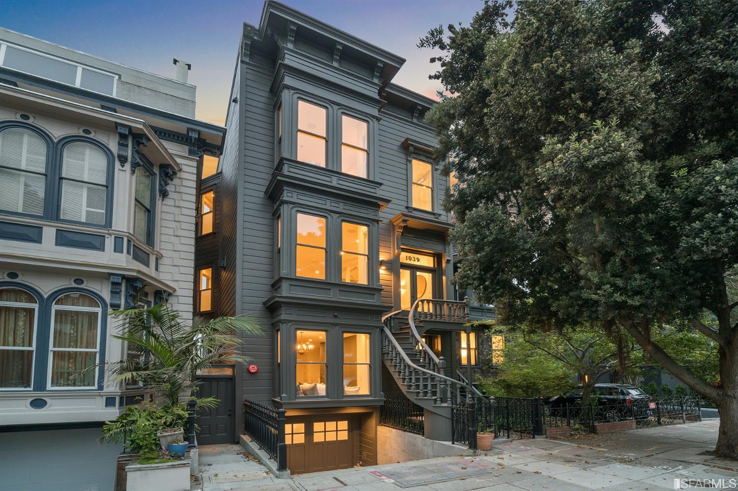 a front view of a residential apartment building with a yard