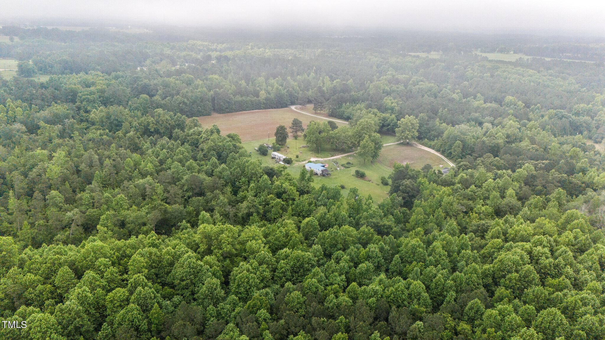 an aerial view of residential house with outdoor space