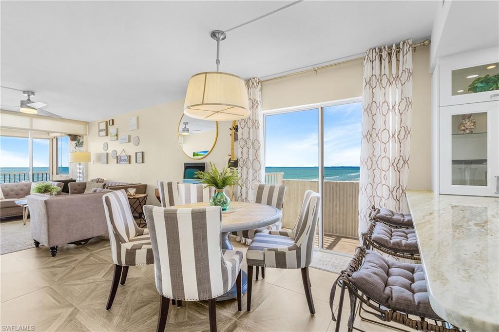 Rare find turnkey corner beachfront Egret residence with 2 balconies and view of the gulf and bay.