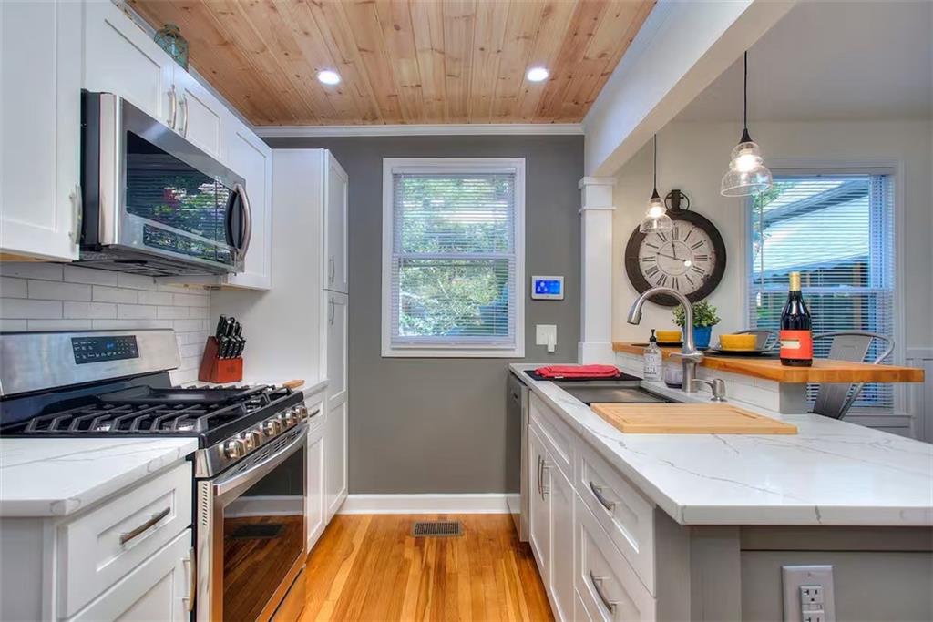 a kitchen that has a lot of cabinets in it