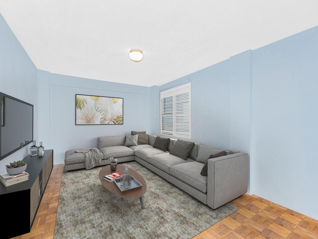 Living room with light parquet flooring