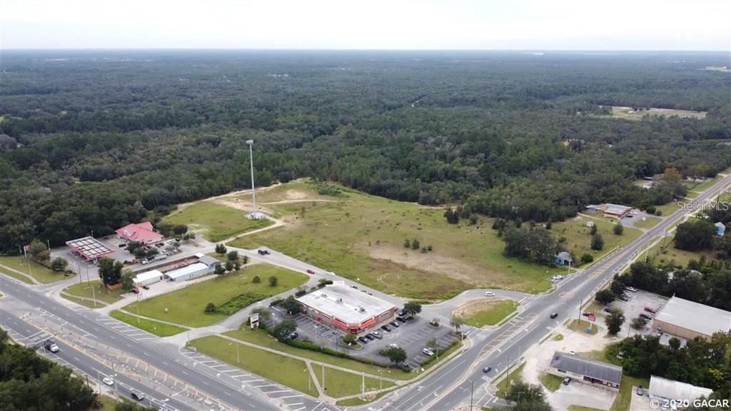 an aerial view of a house with outdoor space