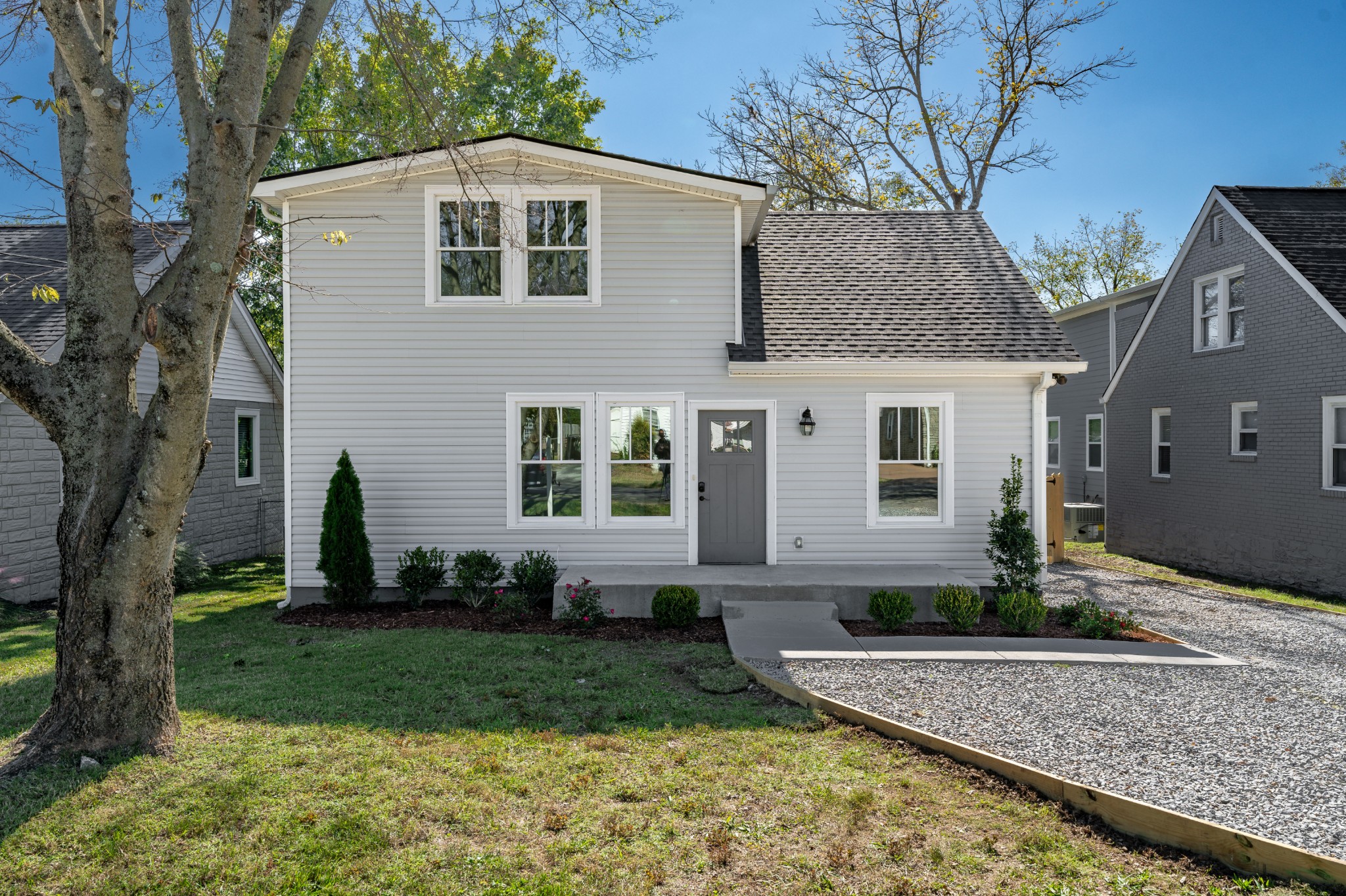 a front view of a house with garden