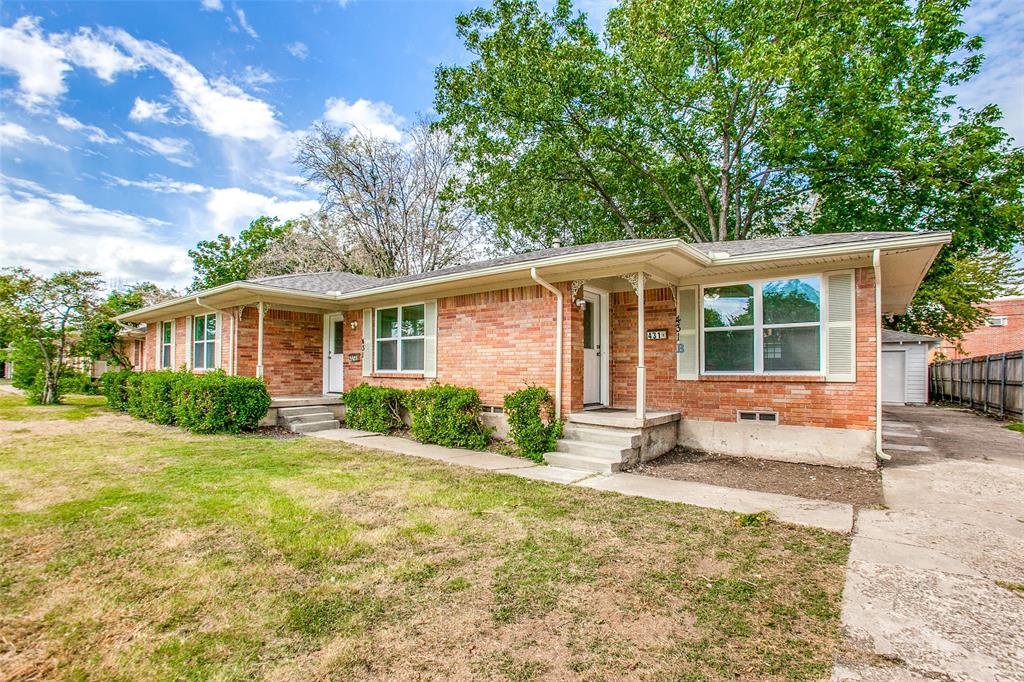 a house that has a tree in front of it