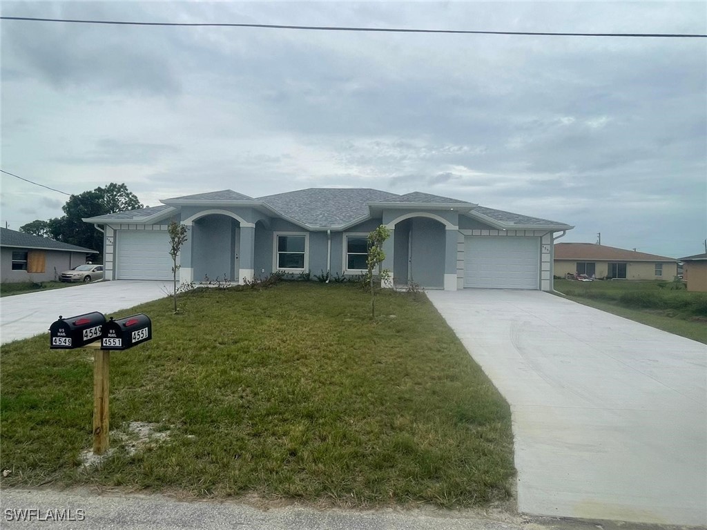 a front view of a house with a garden