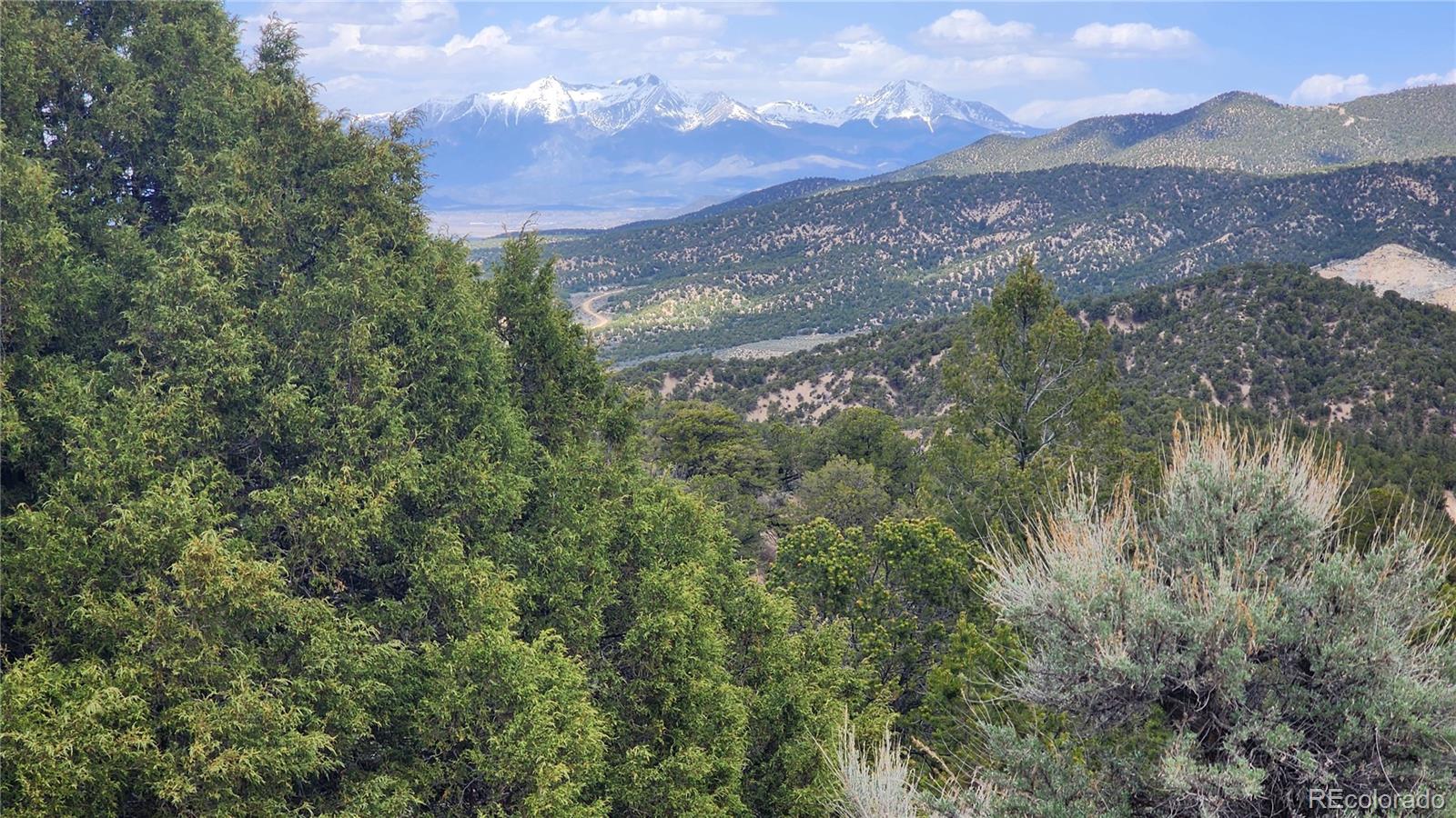 a view of a town with mountains in the background