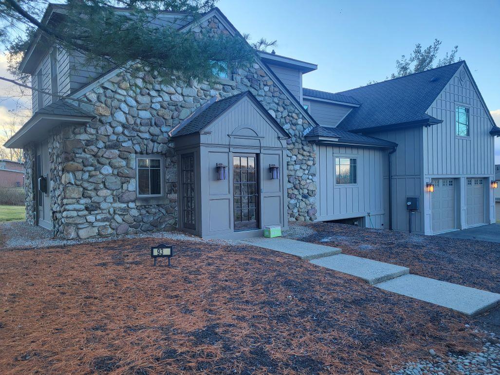 View of front of property featuring a garage