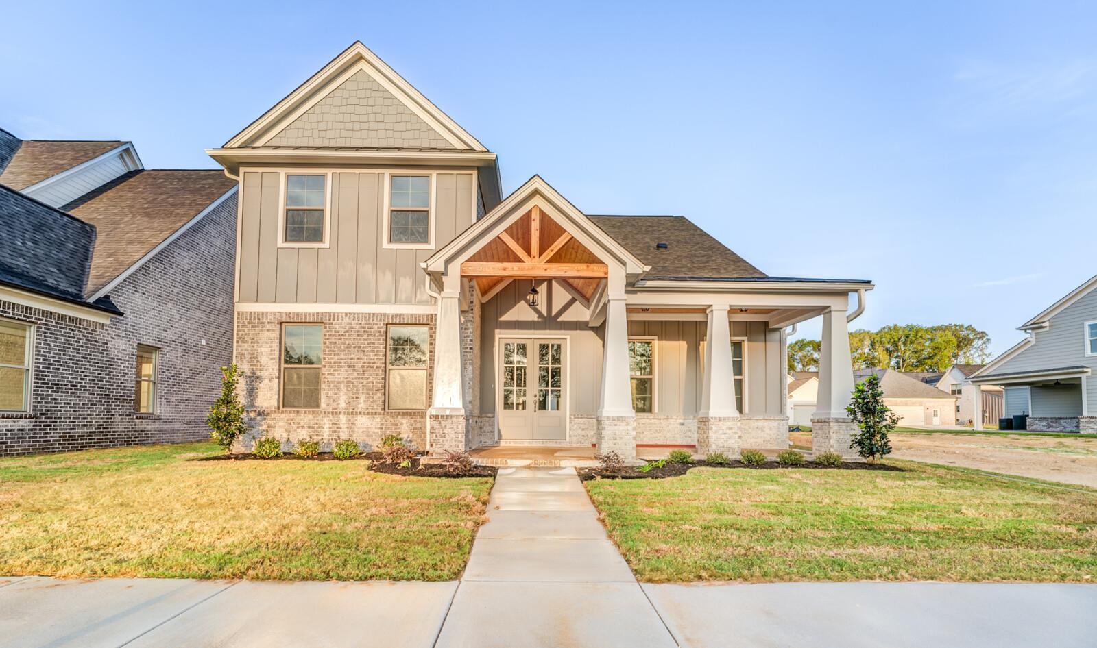 Craftsman-style house with a front yard