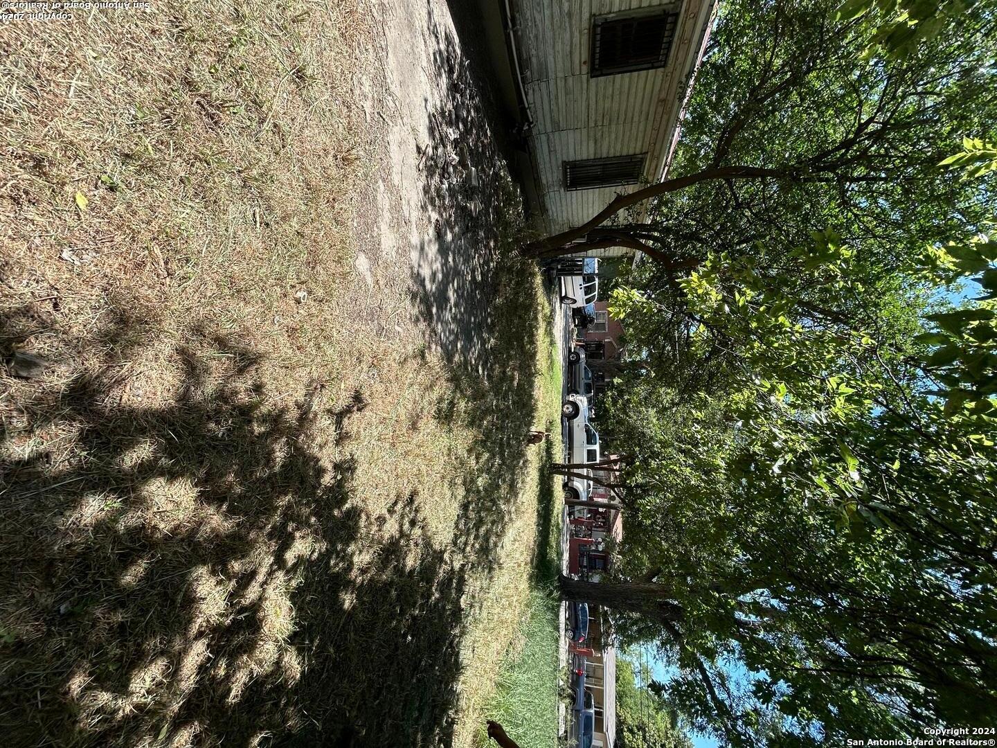 a view of a house with a tree