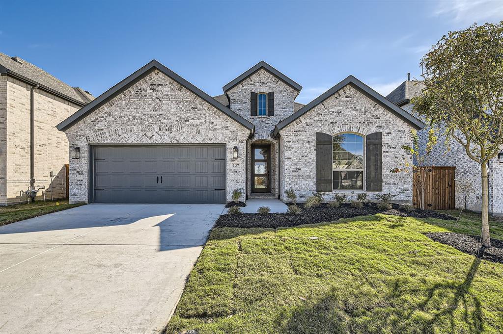 front view of a house with a yard